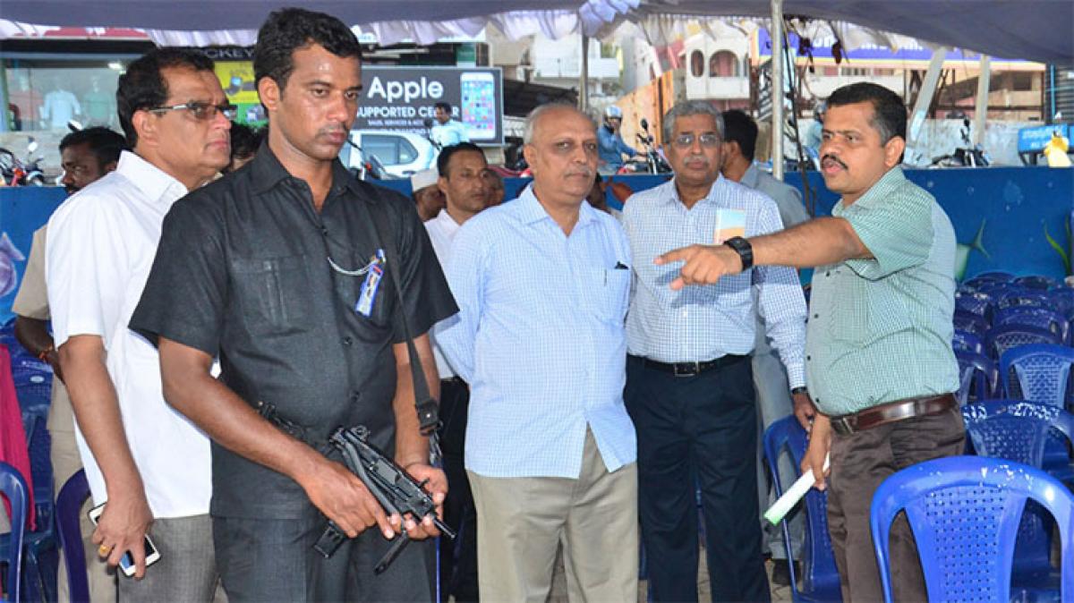 Vizag Collector Dr N Yuvaraj explaining arrangements to DGP J V Ramudu and Chief Secretary I Y R Krishna Rao at RK Beach in Visakhapatnam on Friday